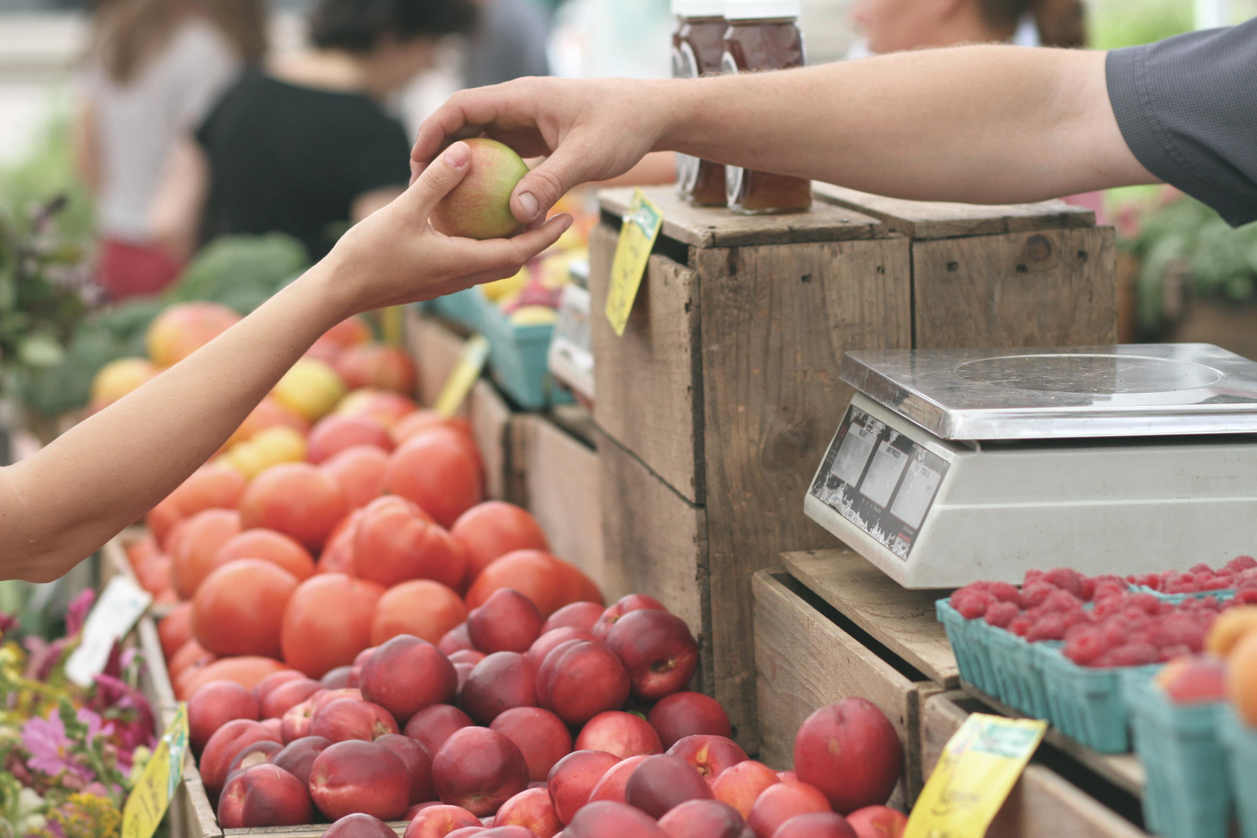 Produce being passed from one person to another